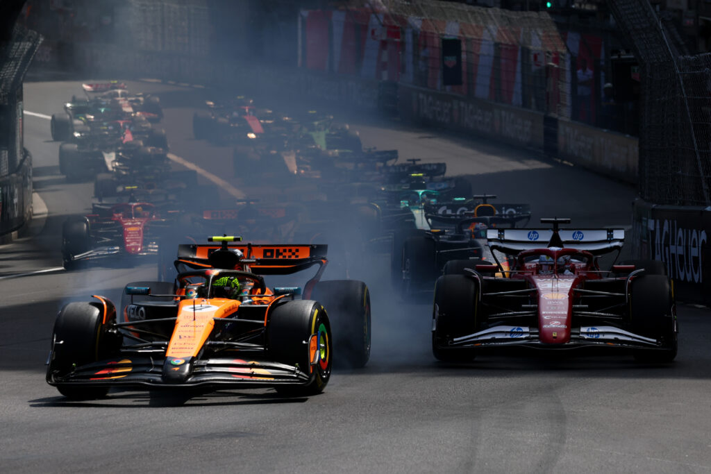 McLaren driver Lando Norris locks up into the first corner ahead of Ferrari driver Charles Leclerc at the start of the 2025 Monaco Grand Prix