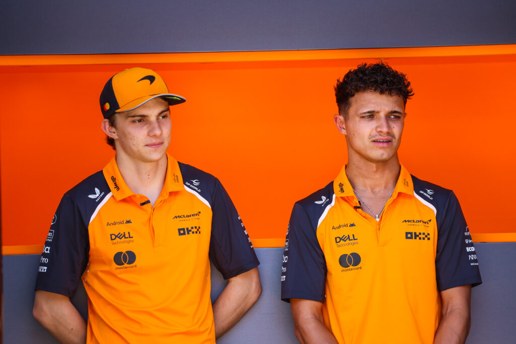 McLaren drivers Oscar Piastri and Lando Norris in the 2025 F1 Spanish Grand Prix paddock