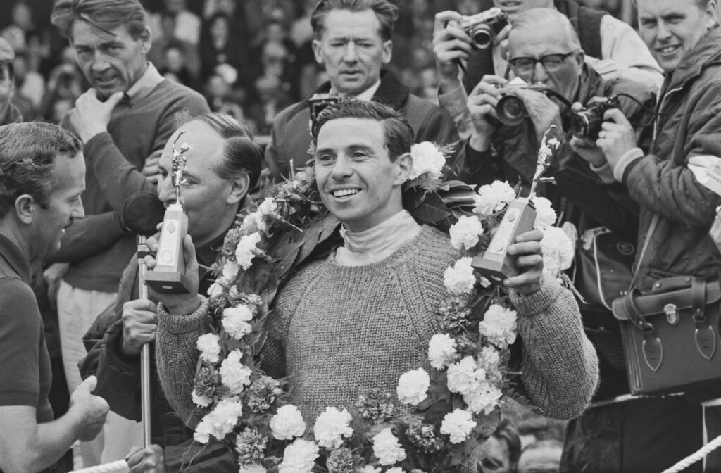 F1 legend Jim Clark celebrates winning a race