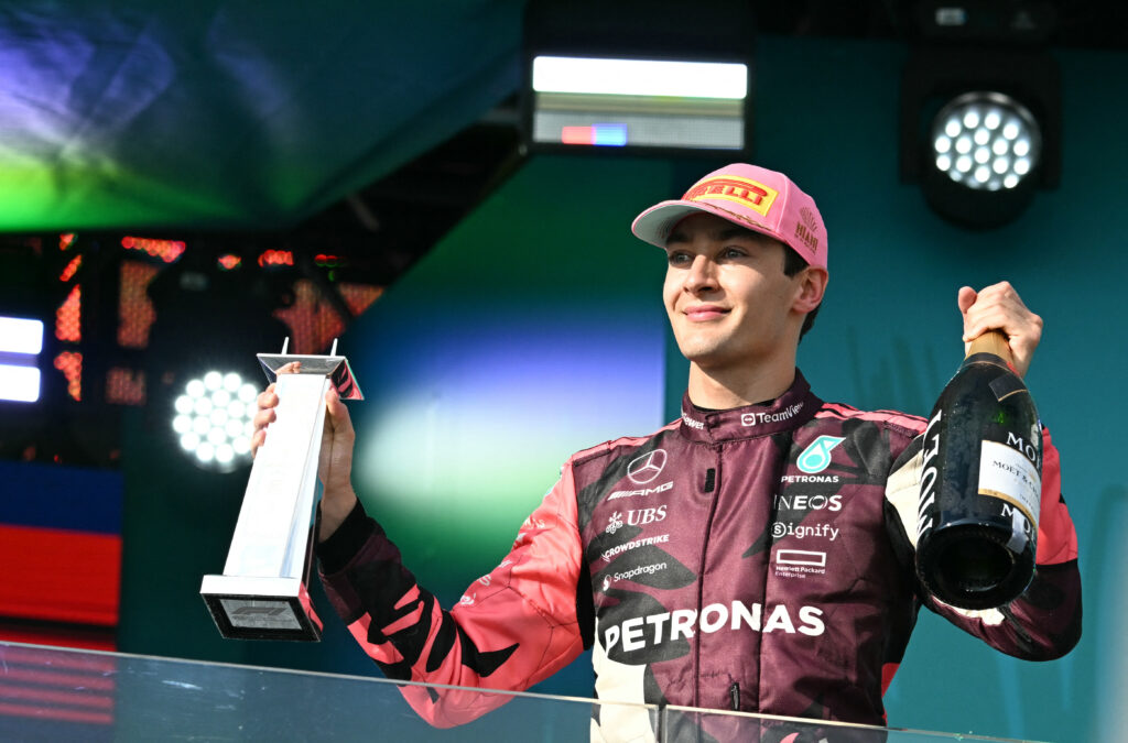 Mercedes driver George Russell celebrates on the podium at the 2025 F1 Miami Grand Prix