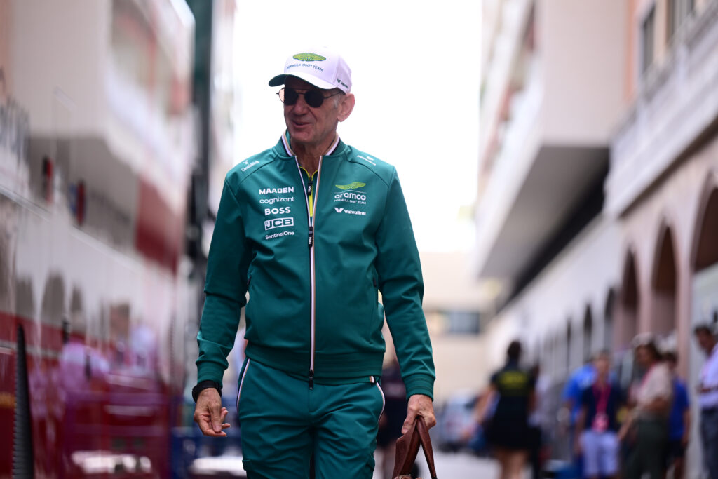 Adrian Newey of Aston Martin walks in the F1 paddock