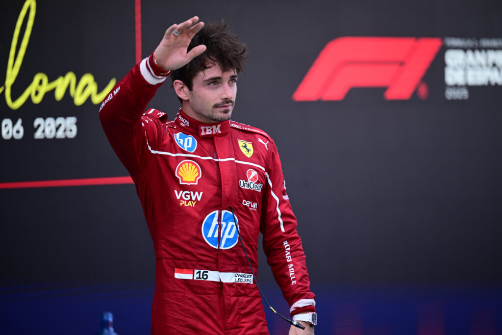 Charles Leclerc of Ferrari waves to the crowd