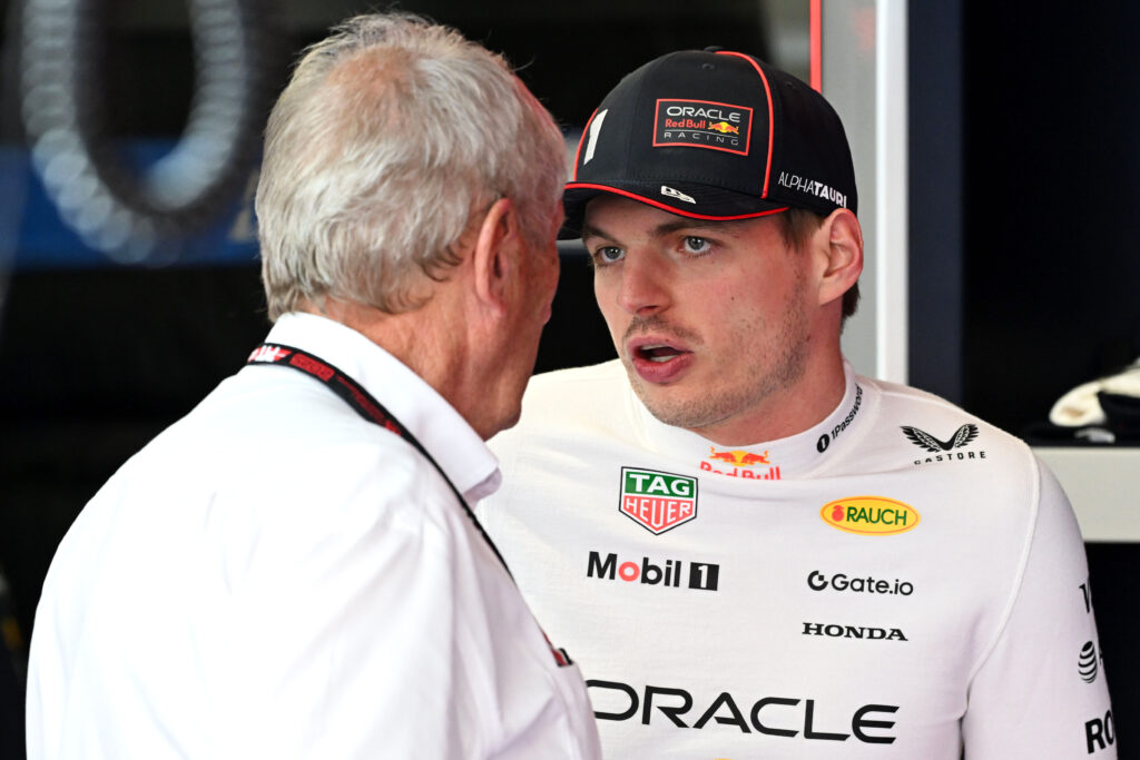 Red Bull chief advisor Helmut Marko and driver Max Verstappen talking at the 2025 Spanish Grand Prix
