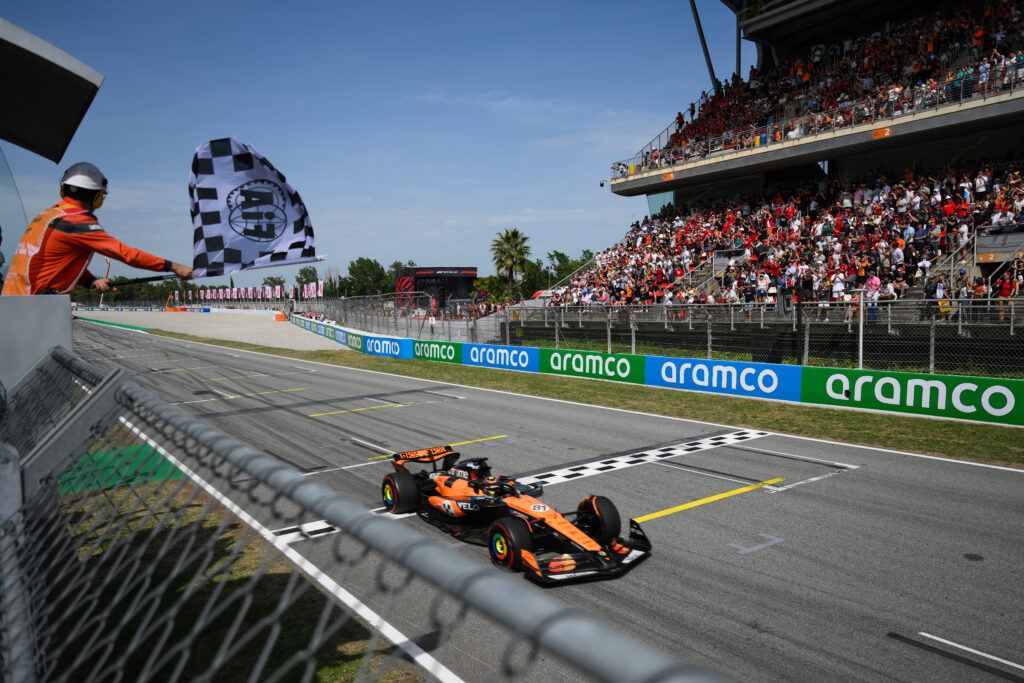Oscar Piastri crosses the line to finish the Spanish GP first.