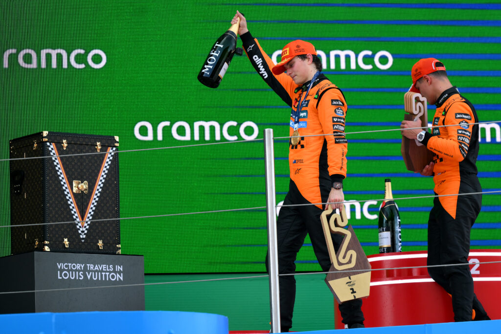McLaren drivers Oscar Piastri and Lando Norris on the podium at the 2025 F1 Spanish Grand Prix