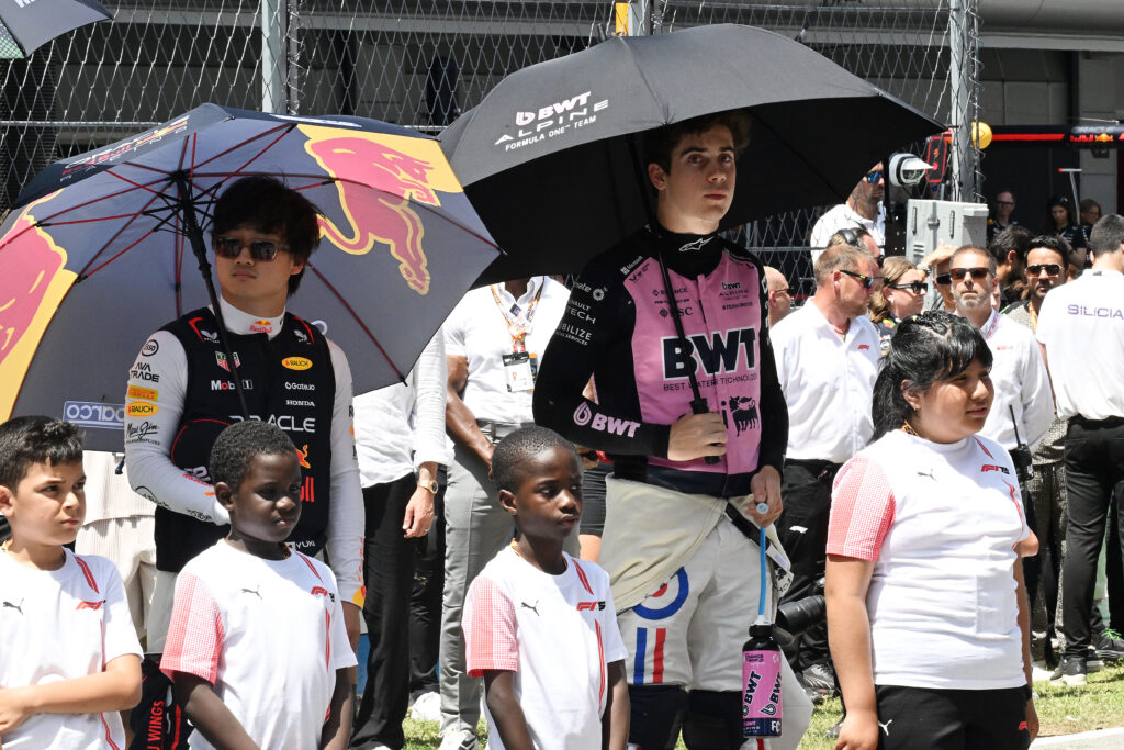 Red Bull and Alpine drivers Yuki Tsunoda and Franco Colapinto on the 2025 F1 Spanish Grand Prix grid