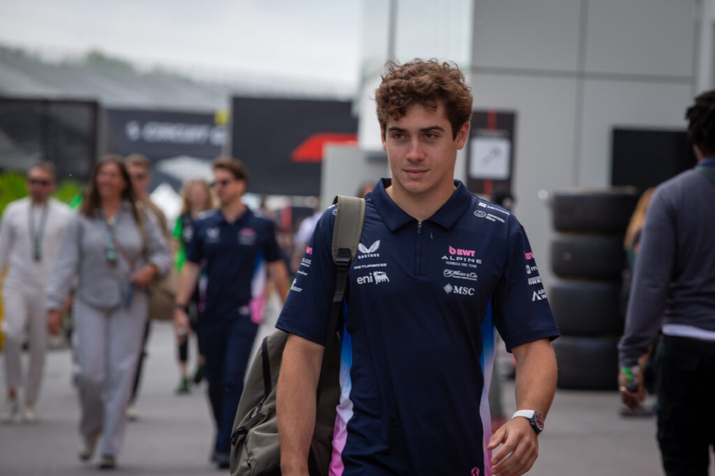 Alpine driver Franco Colapinto walking through the paddock at the 2025 F1 Canadian Grand Prix