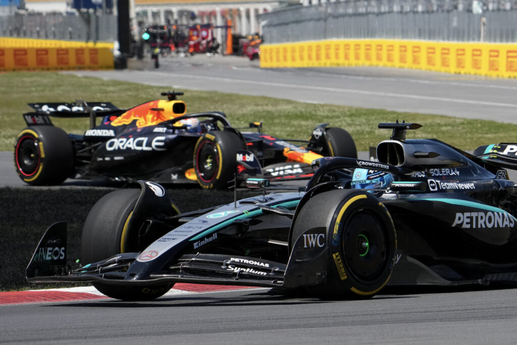 Mercedes driver George Russell leads Max Verstappen of Red Bull during the 2025 F1 Canadian Grand Prix