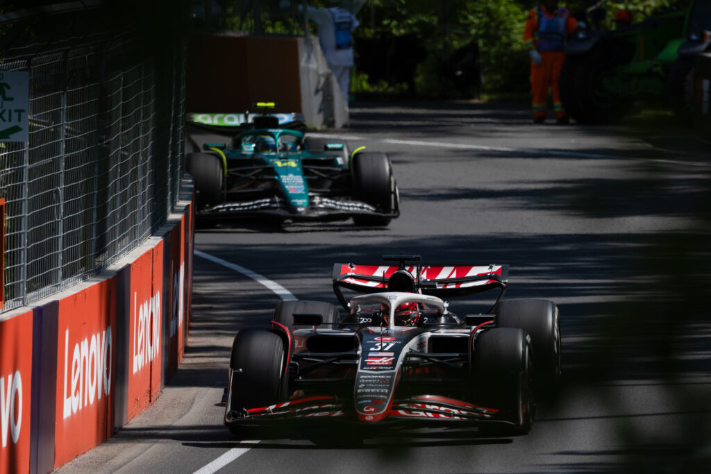 Haas driver Esteban Ocon leads Fernando Alonso of Aston Martin during the 2025 F1 Canadian Grand Prix