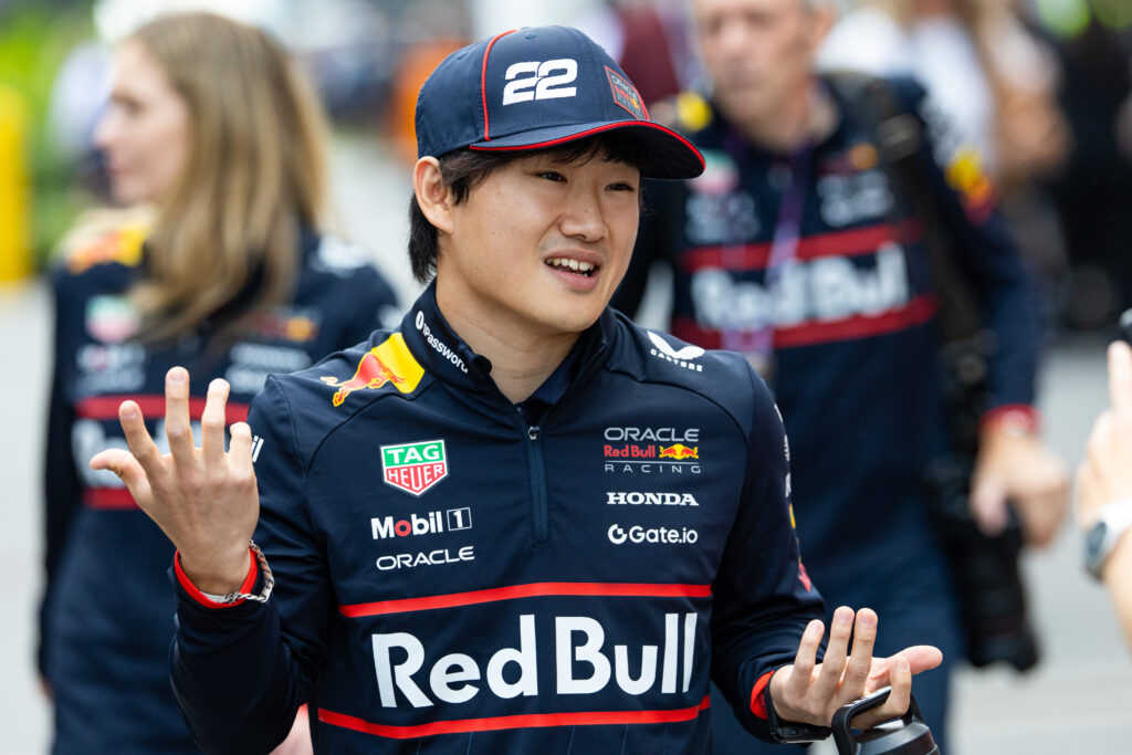 Yuki Tsunoda of Red Bull gestures in the F1 paddock