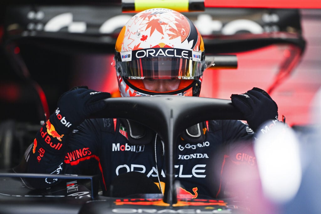 Yuki Tsunoda climbs into the Red Bull F1 car