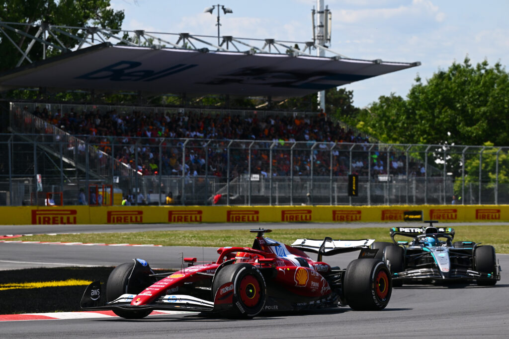 Ferrari driver Charles Leclerc on track with George Russell of Mercedes in the 2025 F1 Canadian Grand Prix
