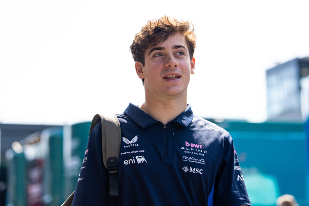 Franco Colapinto of Alpine walks in the F1 paddock