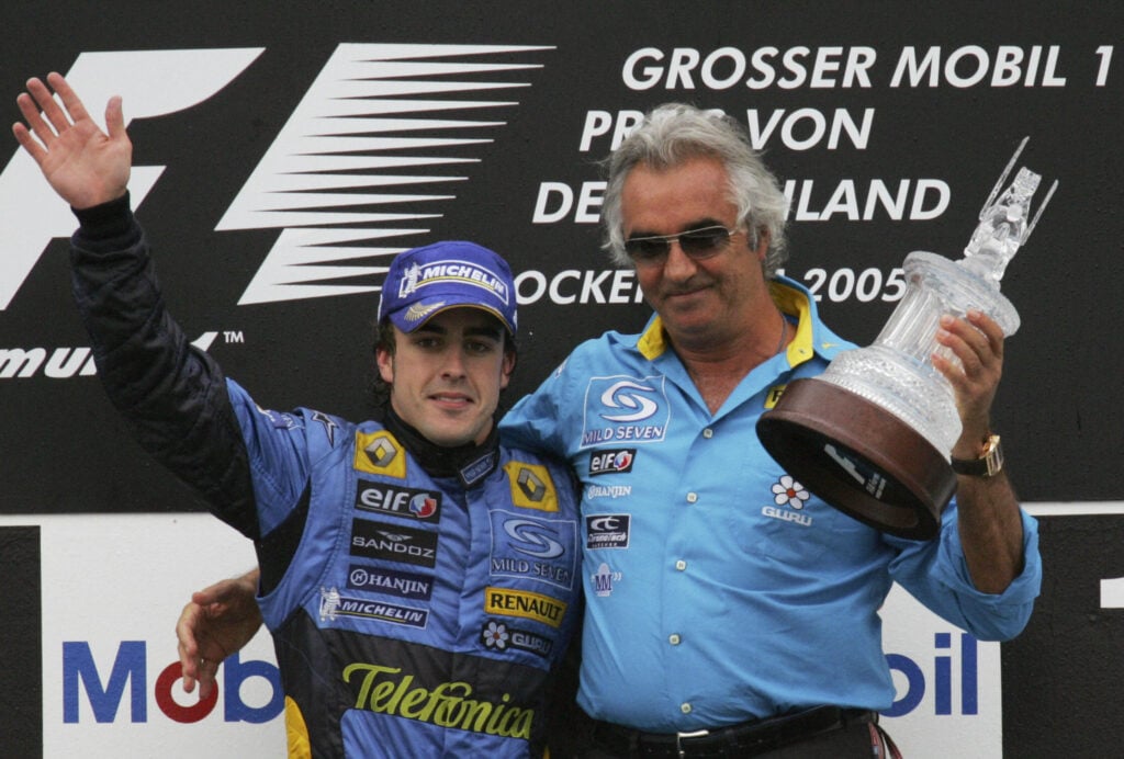 Renault driver Fernando Alonso and team principal Flavio Briatore on the podium at the German Grand Prix