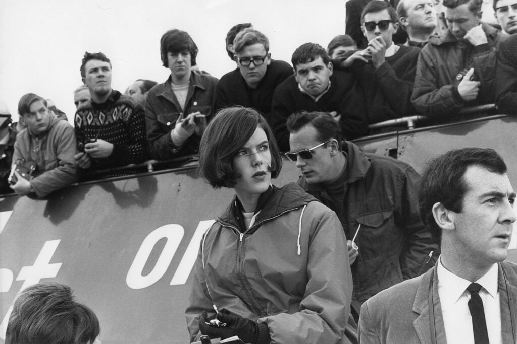 Helen Stewart, wife of Jackie Stewart, at the 1965 British Grand Prix.