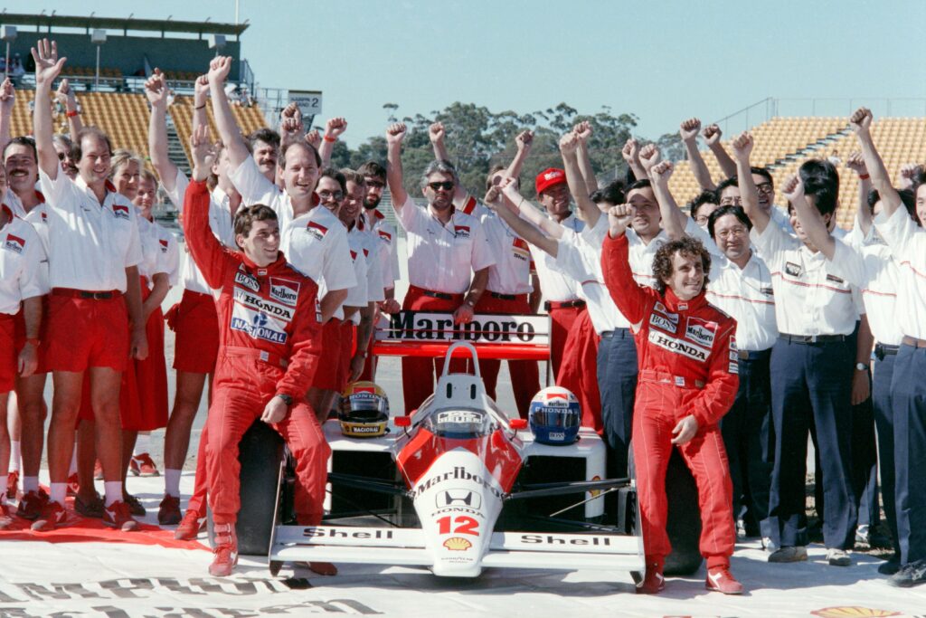 McLaren celebrating with Ayrton Senna and Alain Prost at the end of the 1988 Formula 1 season at the Adelaide Grand Prix
