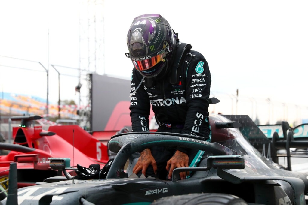 Lewis Hamilton climbs out of his Mercedes after winning the 2020 Turkish Grand Prix