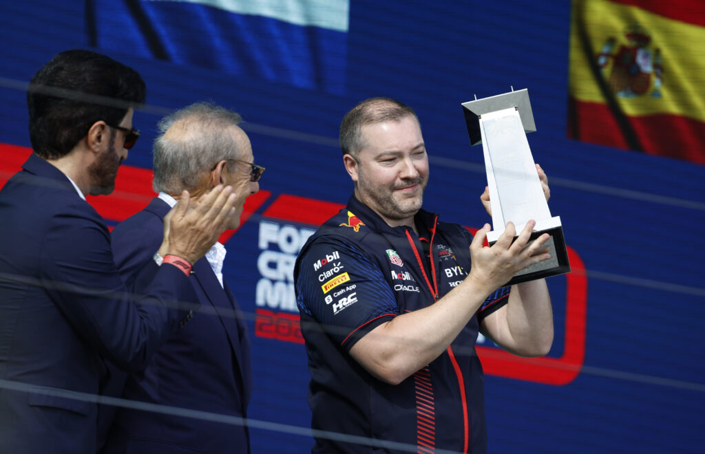 Oliver Smith celebrates on the F1 podium after a Red Bull win
