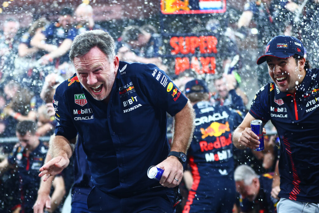Christian Horner is sprayed with champagne following the celebrations of the 2023 Abu Dhabi Grand Prix.