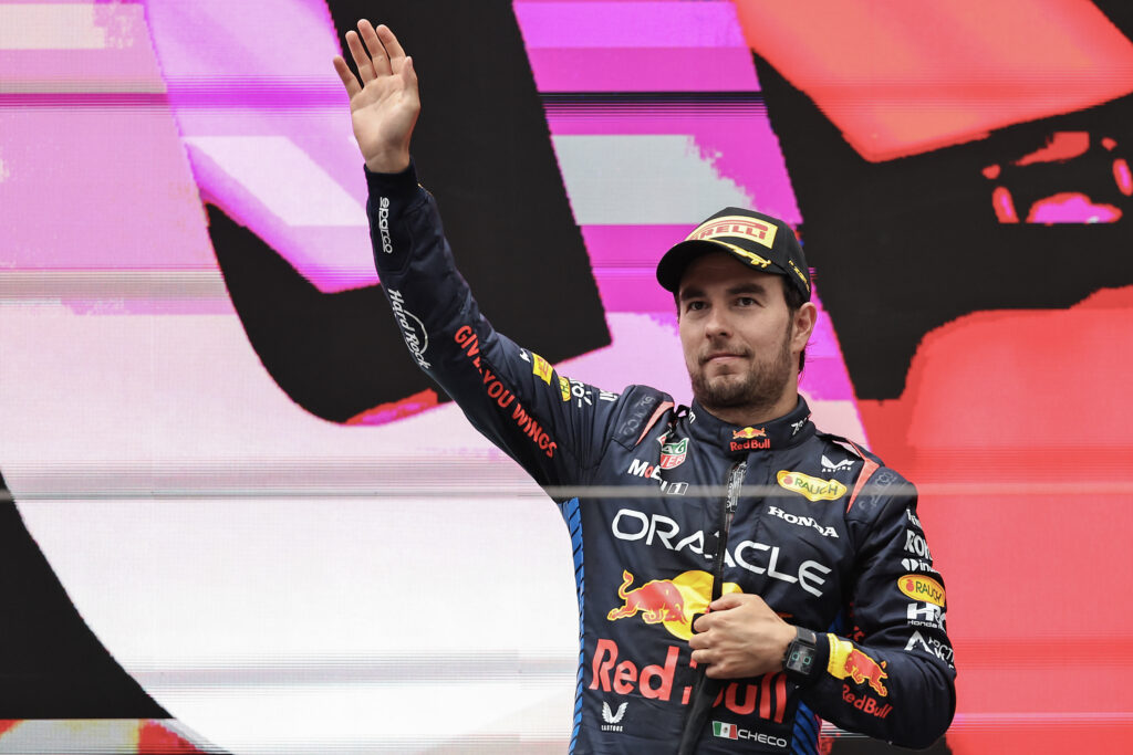Sergio Perez of Red Bull waves from the F1 podium