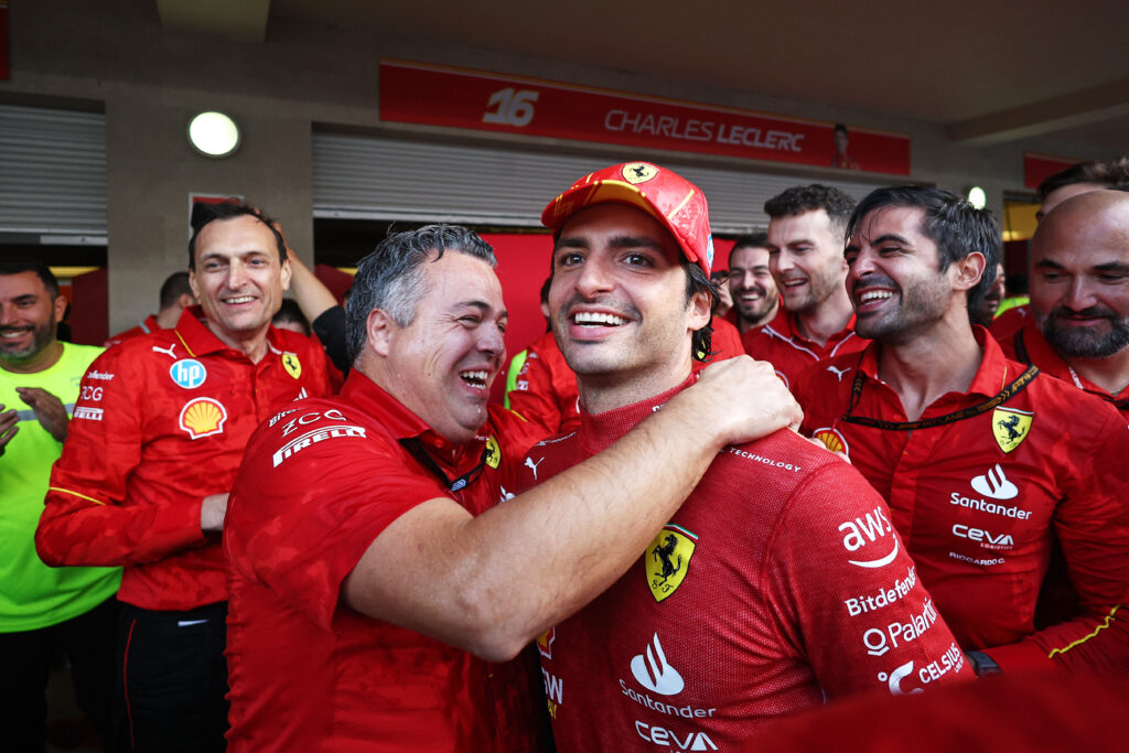Carlos Sainz celebrates with Ferrari after winning an F1 race