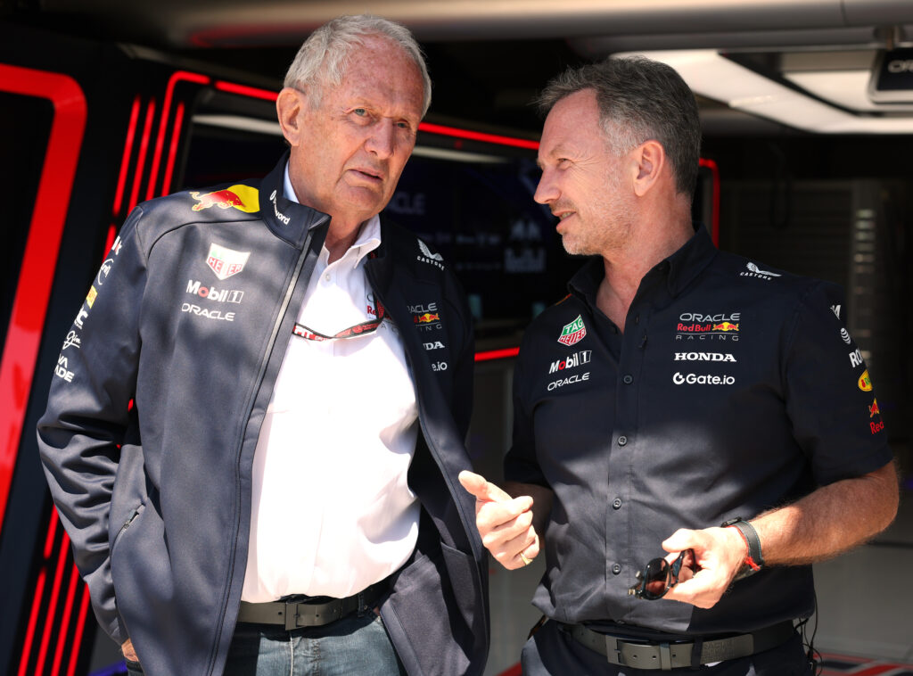Red Bull motorsport adviser Helmut Marko and team principal Christian Horner speak in the garage during practice for the 2025 F1 Emilia Romagna Grand Prix at Imola