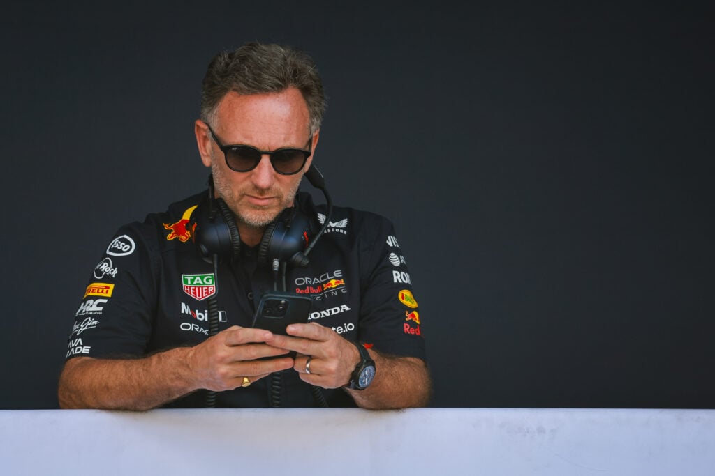 Christian Horner stands on the Red Bull F1 pitwall