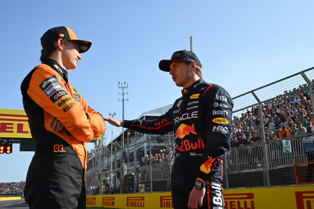 Max Verstappen talking to Oscar Piastri on track at the Canadian Grand Prix.