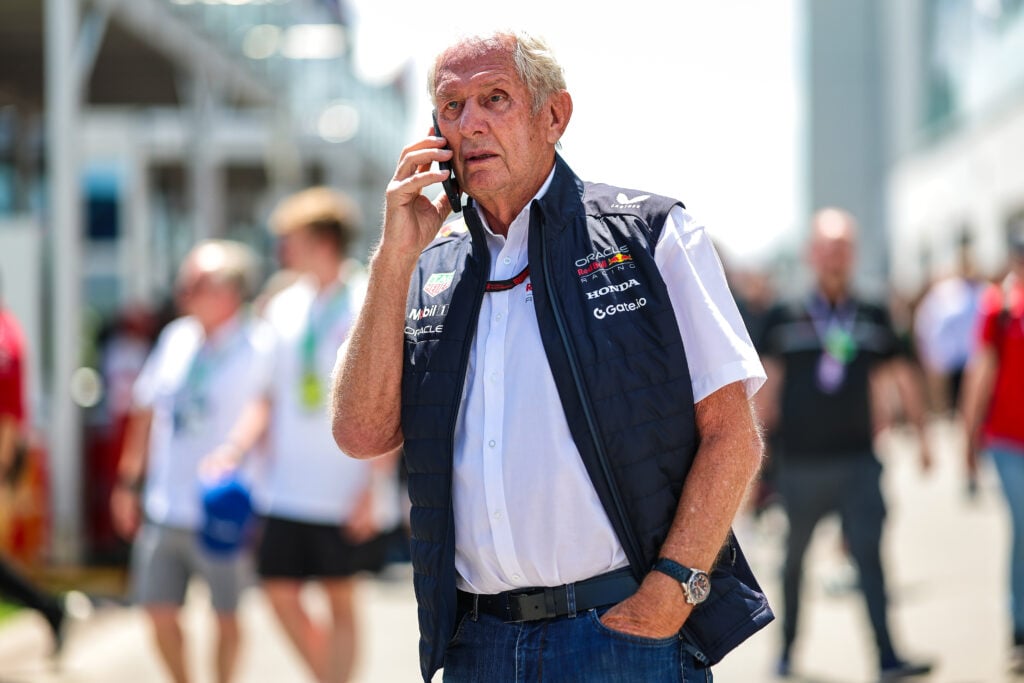Helmut Marko of Red Bull speaks on the phone in the F1 paddock