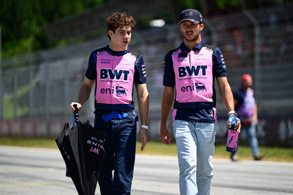 Franco Colapinto and Pierre Gasly of Alpine walking the track at the 2025 Austrian Grand Prix