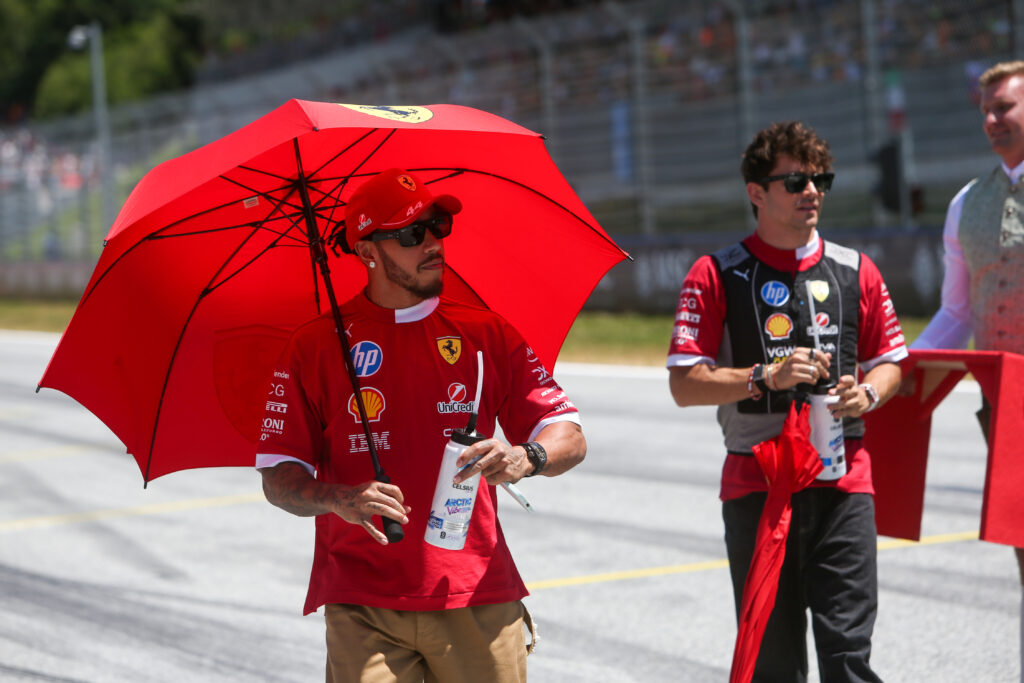 Ferrari's Lewis Hamilton and Charles Leclerc during the drivers' parade before the 2025 F1 Austrian Grand Prix