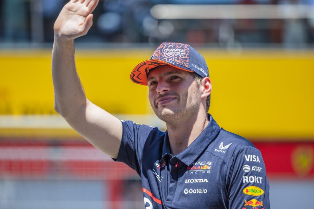 Red Bull Racing driver Max Verstappen waving to the crowd at the 2025 Formula 1 Austrian Grand Prix