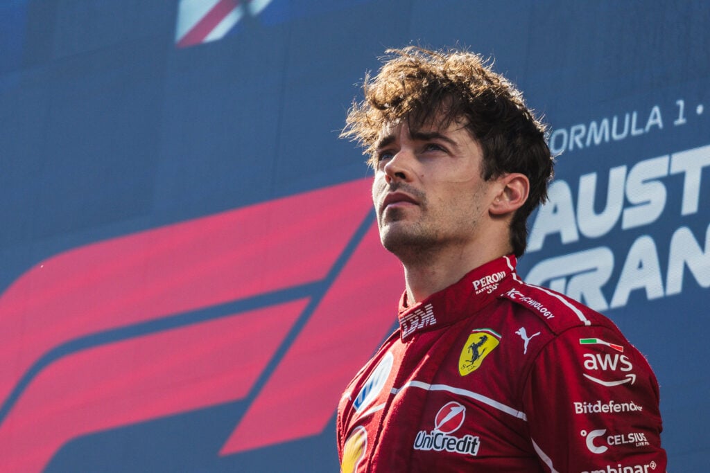 Charles Leclerc of Ferrari stands on the F1 podium
