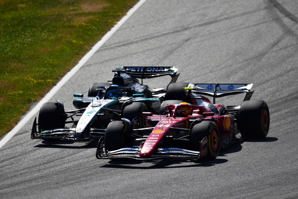 Ferrari driver Lewis Hamilton and Mercedes driver George Russell racing at the 2025 Formula 1 Austrian Grand Prix