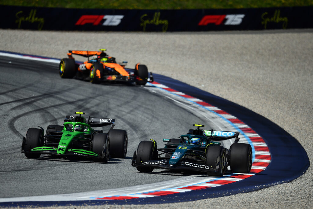 Aston Martin driver Fernando Alonso defends from Gabriel Bortoleto of Sauber during the 2025 F1 Austrian Grand Prix