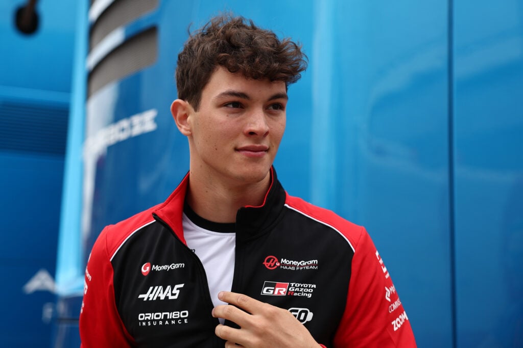 Oliver Bearman of Haas walks in the F1 paddock
