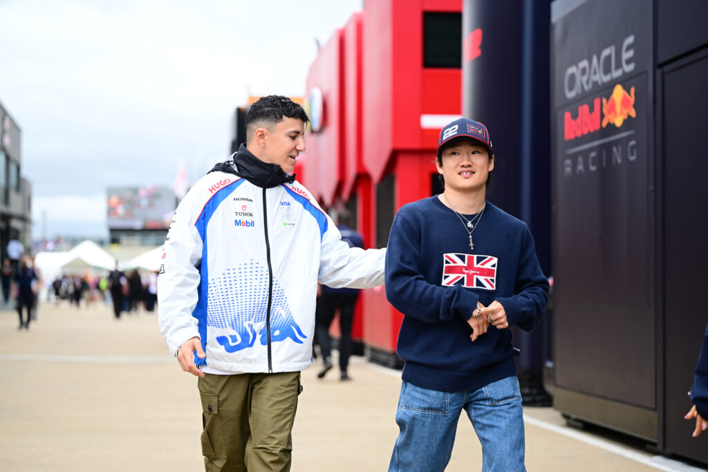 Racing Bulls rookie Isack Hadjar and Red Bull driver Yuki Tsunoda in the 2025 Formula 1 British Grand Prix paddock