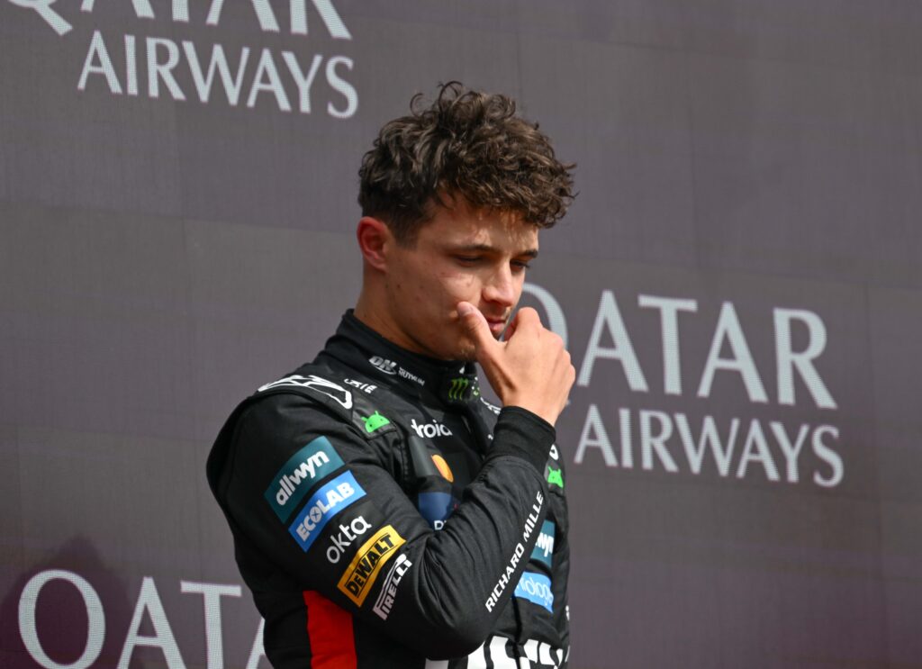 Lando Norris looking down from the podium at the British Grand Prix