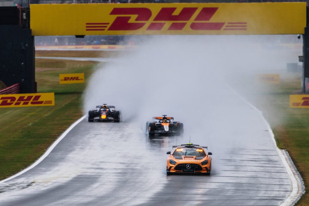 McLaren driver Oscar Piastri leading Red Bull driver Max Verstappen behind the safety car the 2025 Formula 1 British Grand Prix