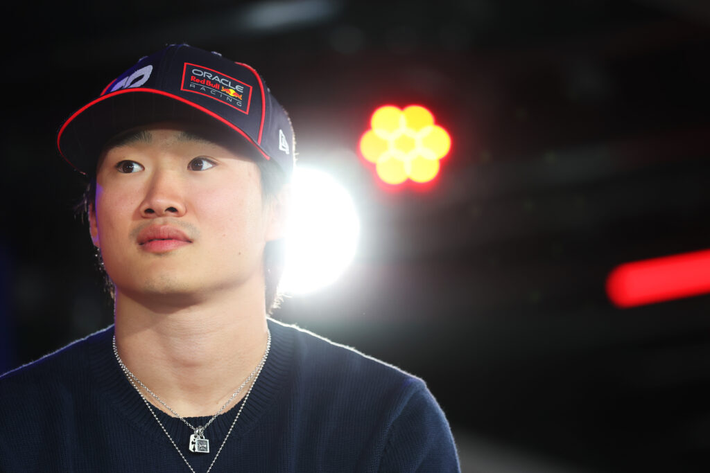 Yuki Tsunoda of Red Bull looks on in the F1 paddock