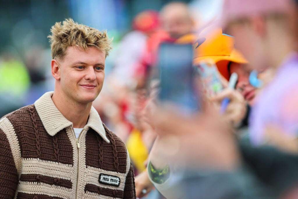 Mick Schumacher interacts with fans in the 2025 F1 British Grand Prix paddock