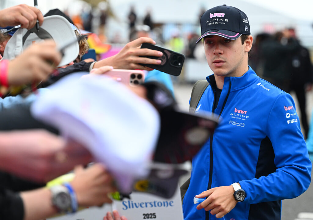 Franco Colapinto of Alpine signing autographs at the 2025 British Grand Prix