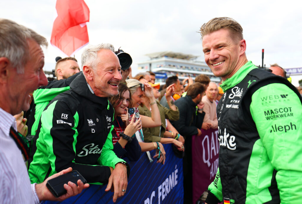 Jonathan Wheatley and Nico Hulkenberg smiling after the latter's podium at the British Grand Prix.