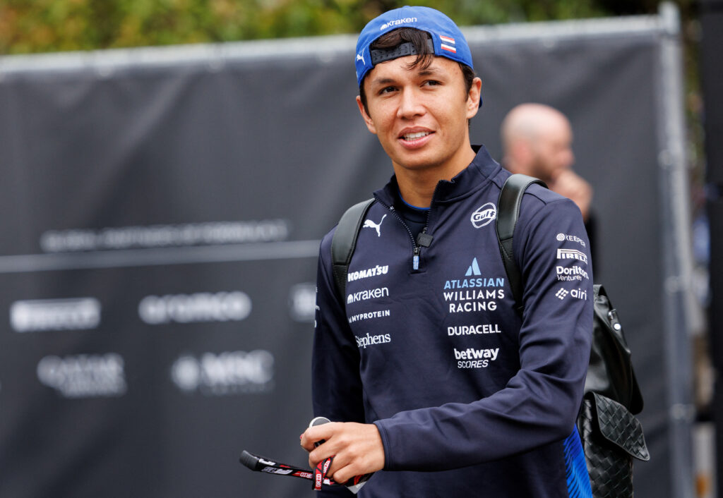 Williams driver Alex Albon arrives in the paddock before the 2025 F1 Belgian Grand Prix