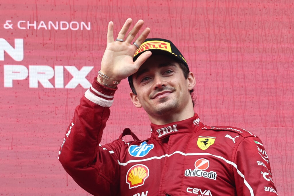 Charles Leclerc of Ferrari waves on the F1 podium