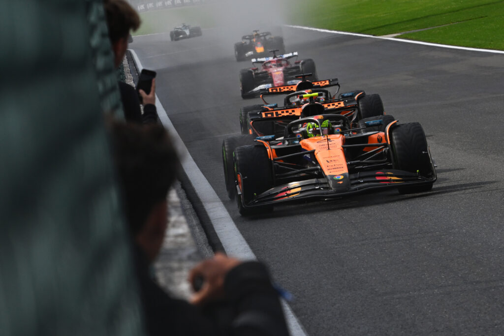 McLaren drivers Lando Norris and Oscar Piastri racing at the 2025 Formula 1 Belgian Grand Prix