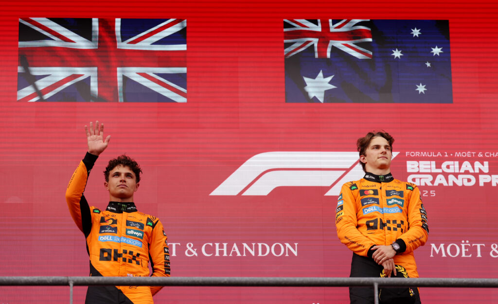 McLaren drivers Lando Norris and Oscar Piastri on the podium at the 2025 Formula 1 British Grand Prix