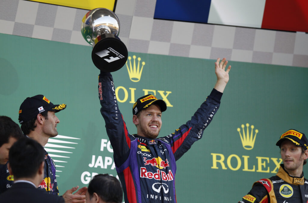 Red Bull driver Sebastian Vettel celebrates winning the 2013 Japanese Grand Prix at Suzuka