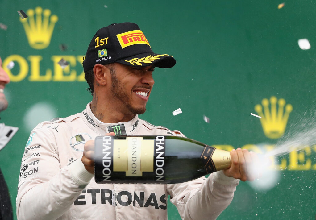 Lewis Hamilton celebrates on the F1 podium for Mercedes