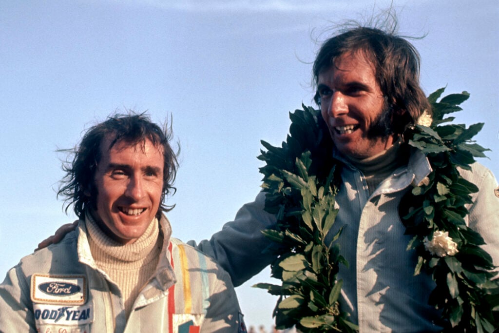 Emerson Fittipaldi and Jackie Stewart on the podium at the 1973 Formula 1 Argentine Grand Prix